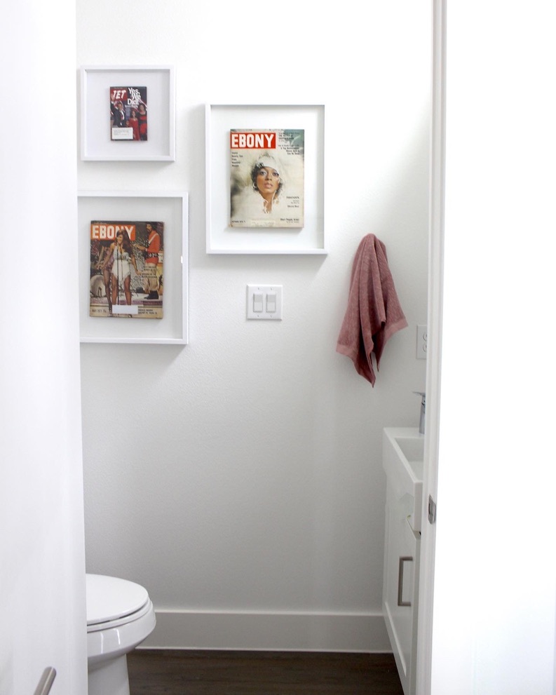 gallery wall in white bathroom