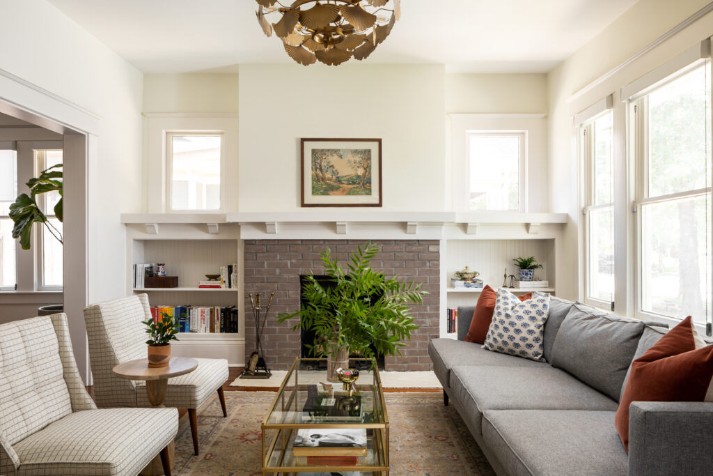 neutral interior design with gray sofa and gold accents